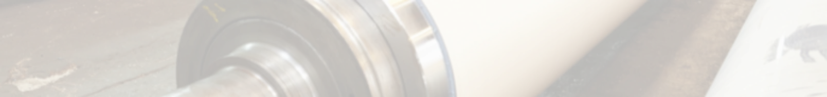 Close-up of industrial calender roll used in high-pressure material processing