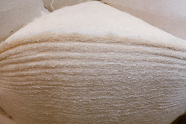 Cotton disc preparation for compressed fiber calender roll filling